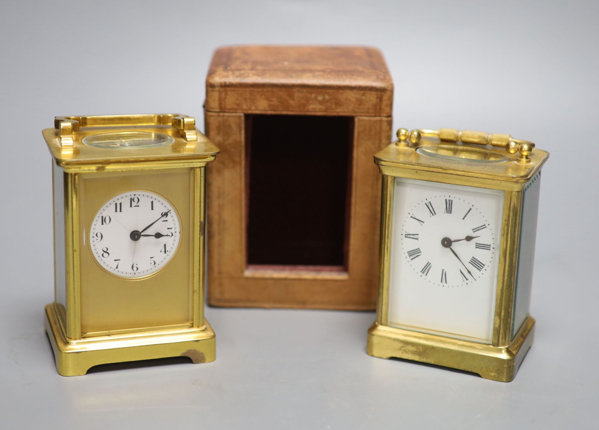 Two French gilt brass carriage timepieces, one cased